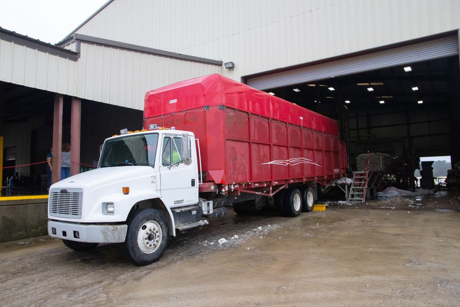 Material being loaded onto a delivery truck